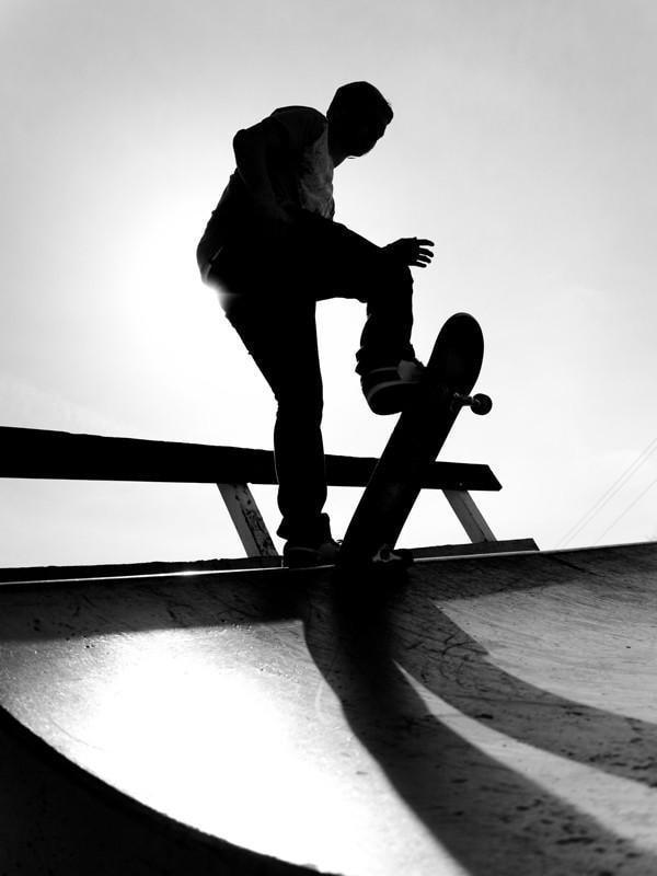 Silhouette of a young skateboarder Wall Mural-Black & White,Sports,Urban-Eazywallz